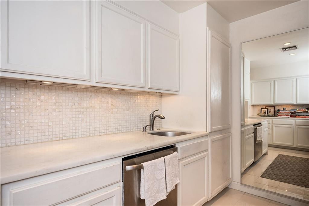 145 15th Street Northeast, Unit 1225 Atlanta, GA 30361 - Photo 12 of 54 a kitchen with a sink cabinets and appliances