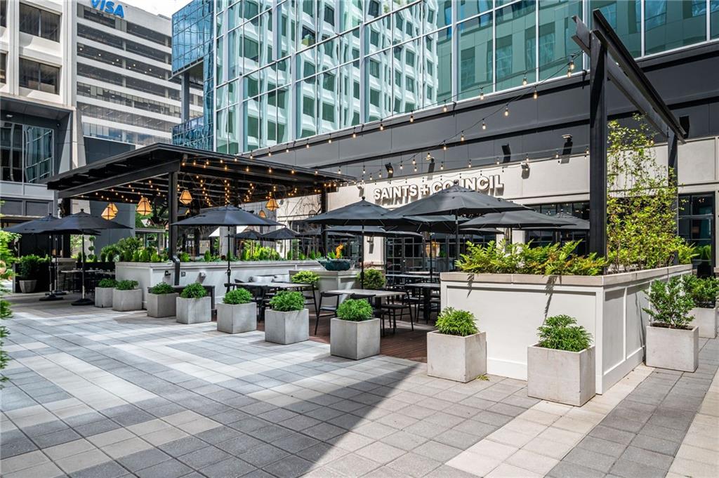 145 15th Street Northeast, Unit 1225 Atlanta, GA 30361 - Photo 24 of 54 a view of a chairs and table in a patio