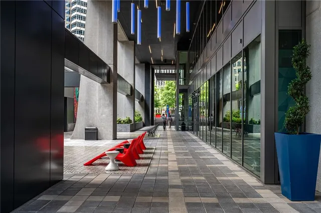 a patio with a table and chairs under an umbrella