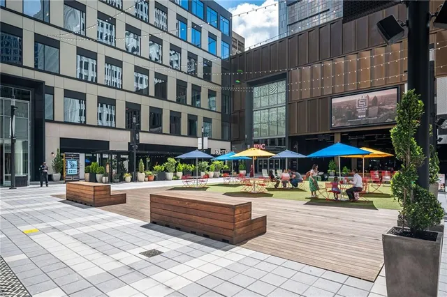 a view of a patio with plants and chairs