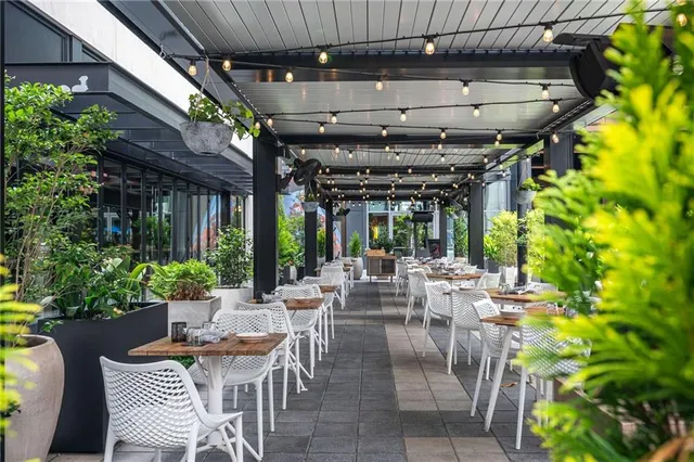 a view of building with cars parked