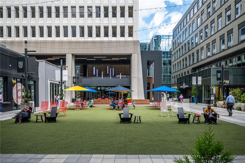 145 15th Street Northeast, Unit 1225 Atlanta, GA 30361 - Photo 35 of 54 a view of building with cars parked