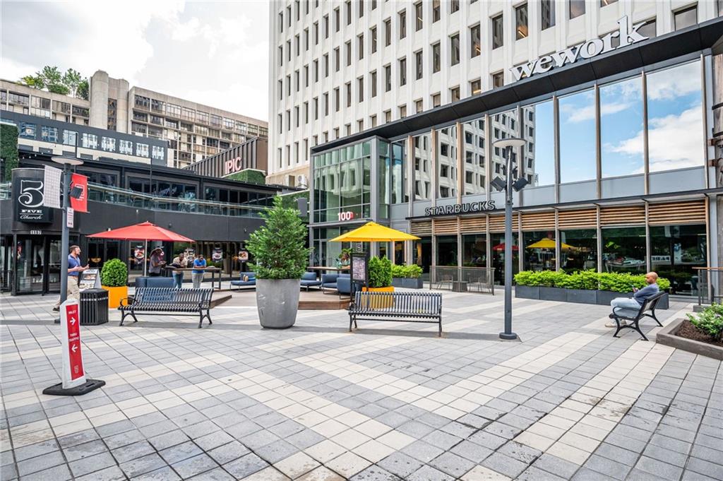 145 15th Street Northeast, Unit 1225 Atlanta, GA 30361 - Photo 43 of 54 a view of a building with sitting area