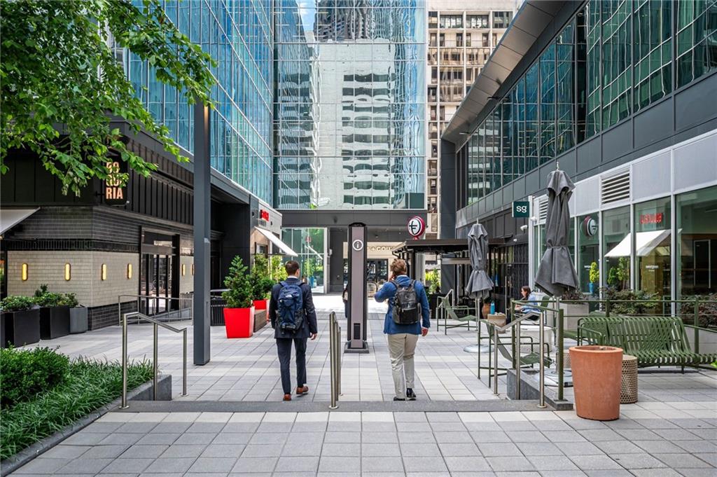145 15th Street Northeast, Unit 1225 Atlanta, GA 30361 - Photo 47 of 54 a view of path along with building and outdoor seating