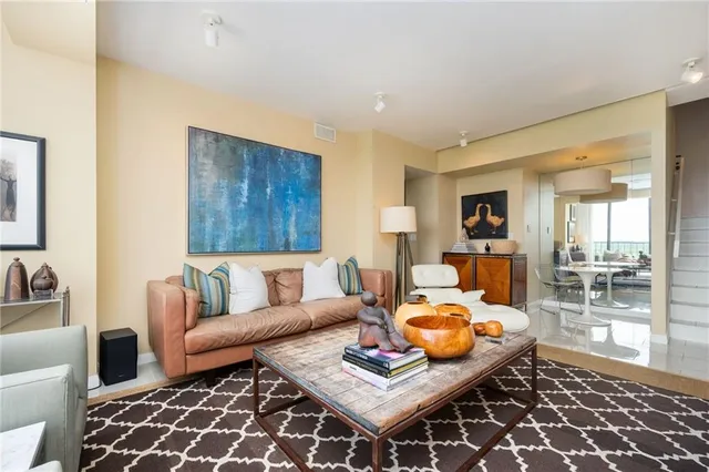 a living room with furniture and a rug