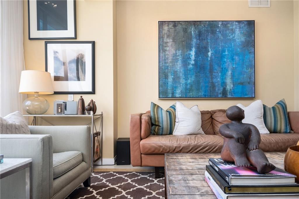 145 15th Street Northeast, Unit 1225 Atlanta, GA 30361 - Photo 7 of 54 a living room with furniture and a couch
