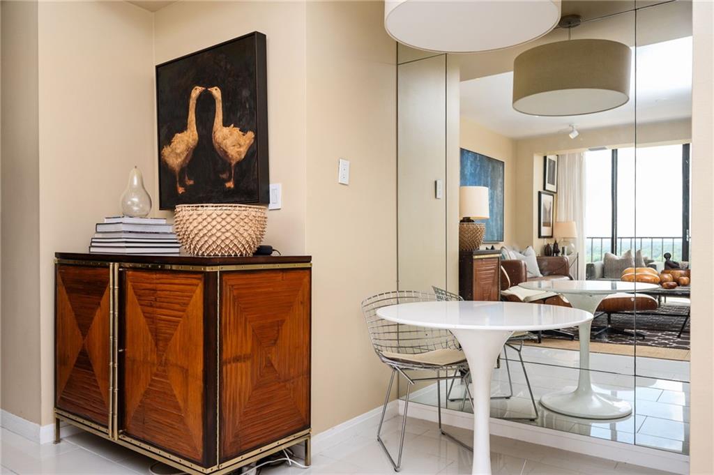 145 15th Street Northeast, Unit 1225 Atlanta, GA 30361 - Photo 8 of 54 a dining room with furniture and a window