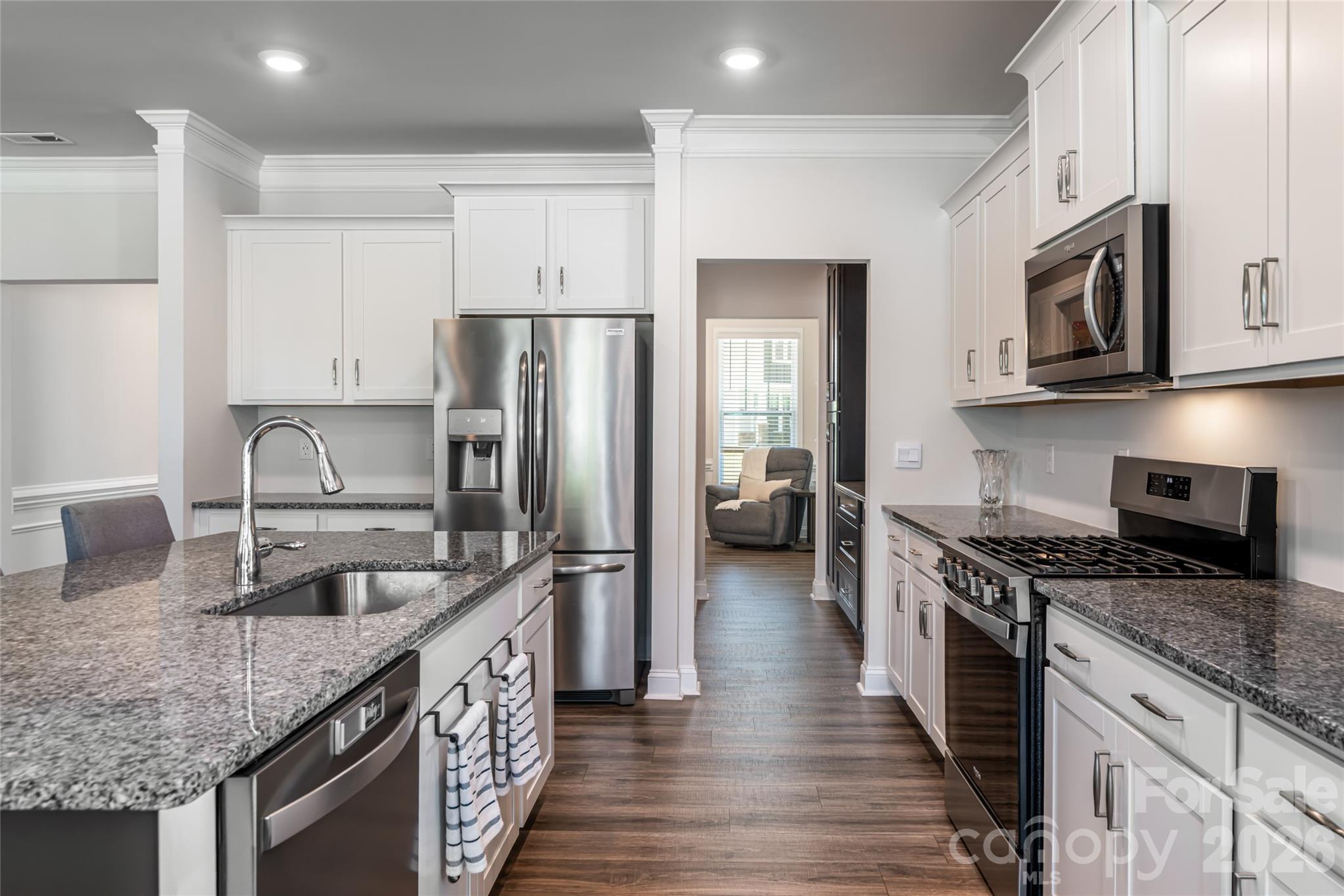 615 Fox Cove Road Hendersonville, NC 28792 - Photo 20 of 47 a kitchen with stainless steel appliances granite countertop a kitchen island a stove a sink and a refrigerator