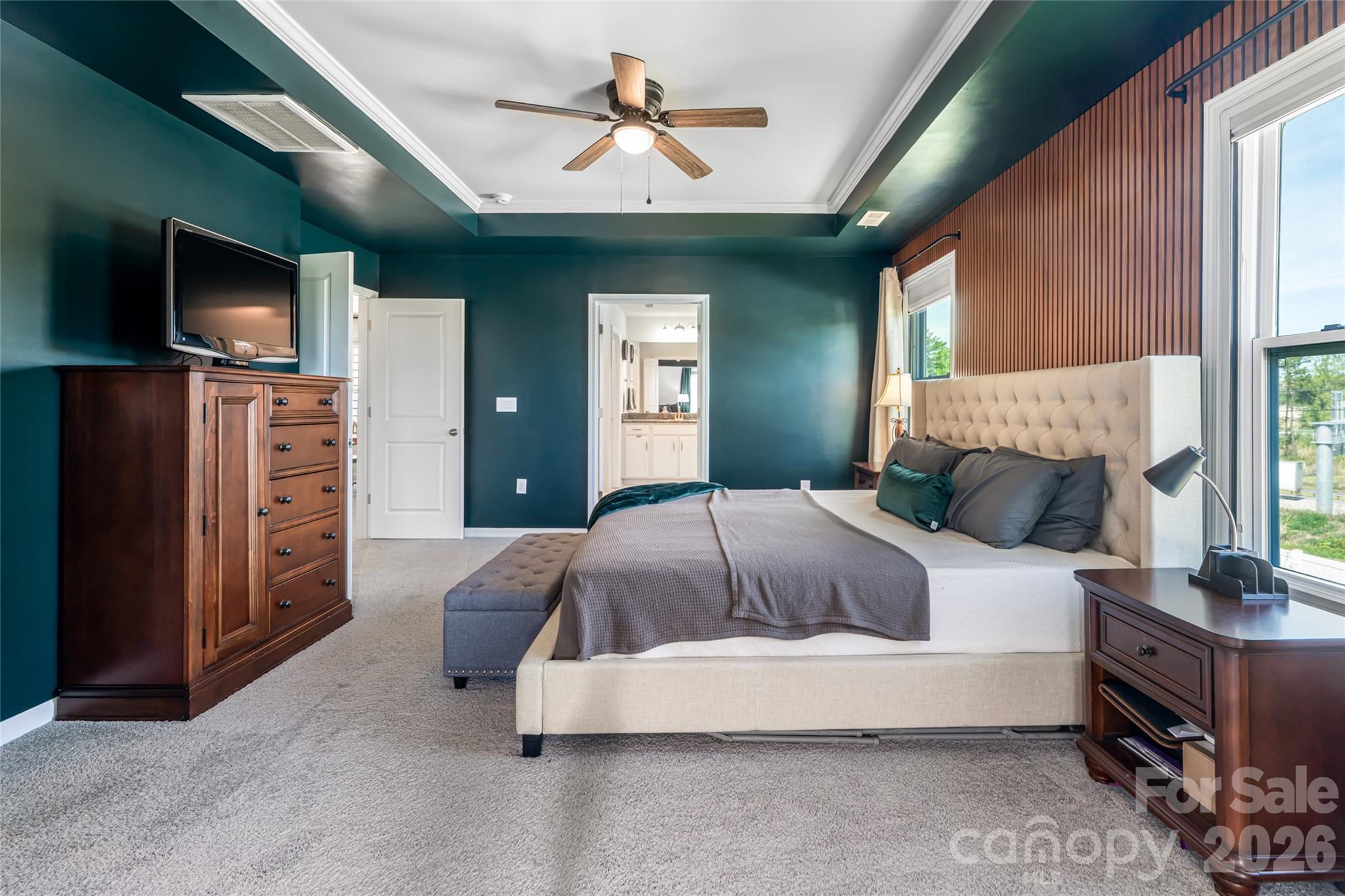 615 Fox Cove Road Hendersonville, NC 28792 - Photo 26 of 47 a bedroom with a bed and a flat screen tv