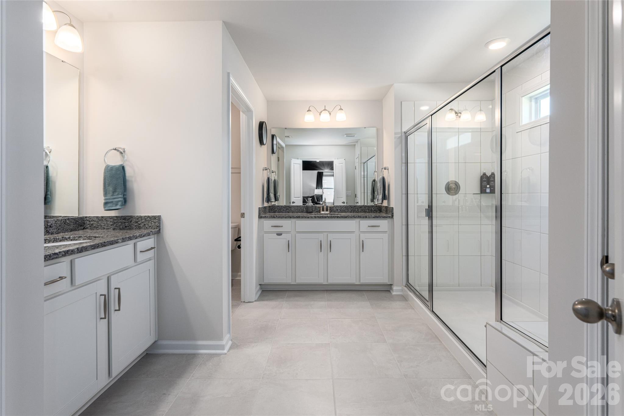 615 Fox Cove Road Hendersonville, NC 28792 - Photo 29 of 47 a bathroom with a double vanity sink mirror and shower
