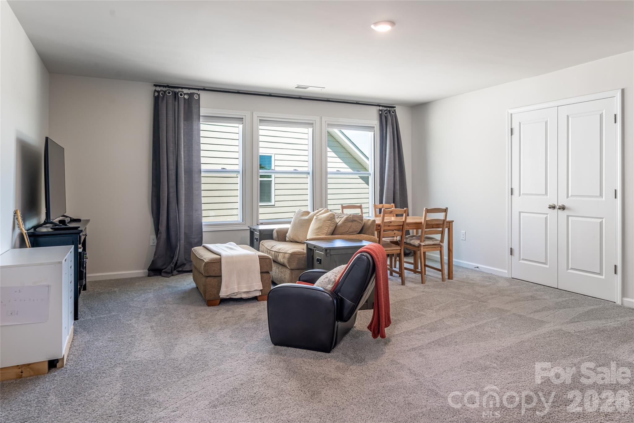 615 Fox Cove Road Hendersonville, NC 28792 - Photo 32 of 47 a living room with furniture and a flat screen tv