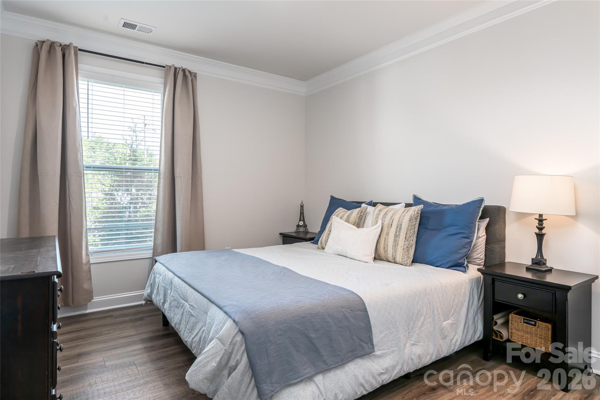 615 Fox Cove Road Hendersonville, NC 28792 - Photo 34 of 47 a bedroom with a bed and wooden floor