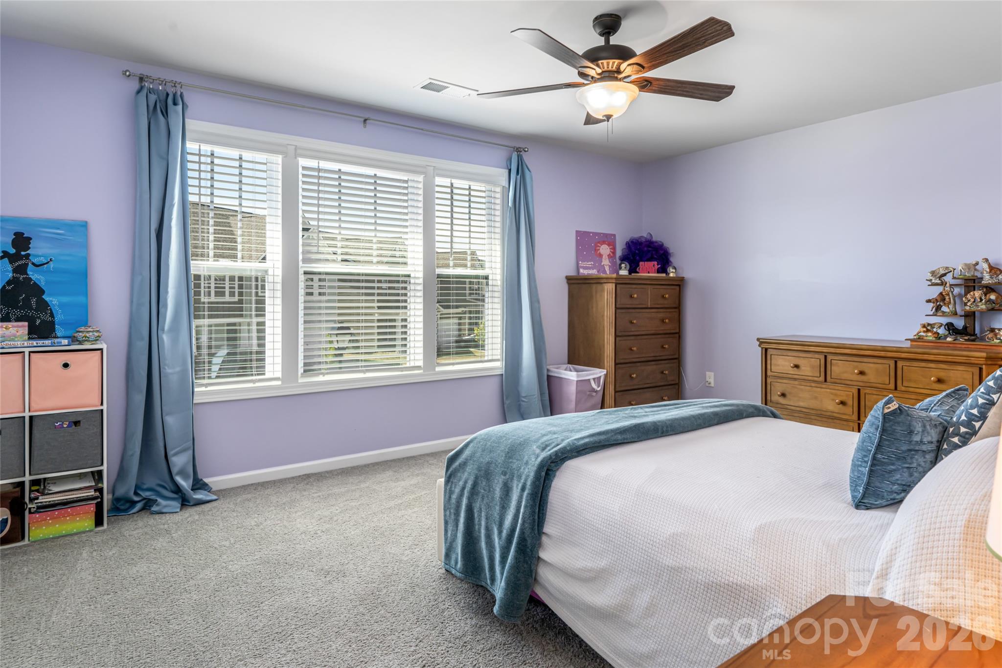 615 Fox Cove Road Hendersonville, NC 28792 - Photo 36 of 47 a bedroom with a bed and a chandelier