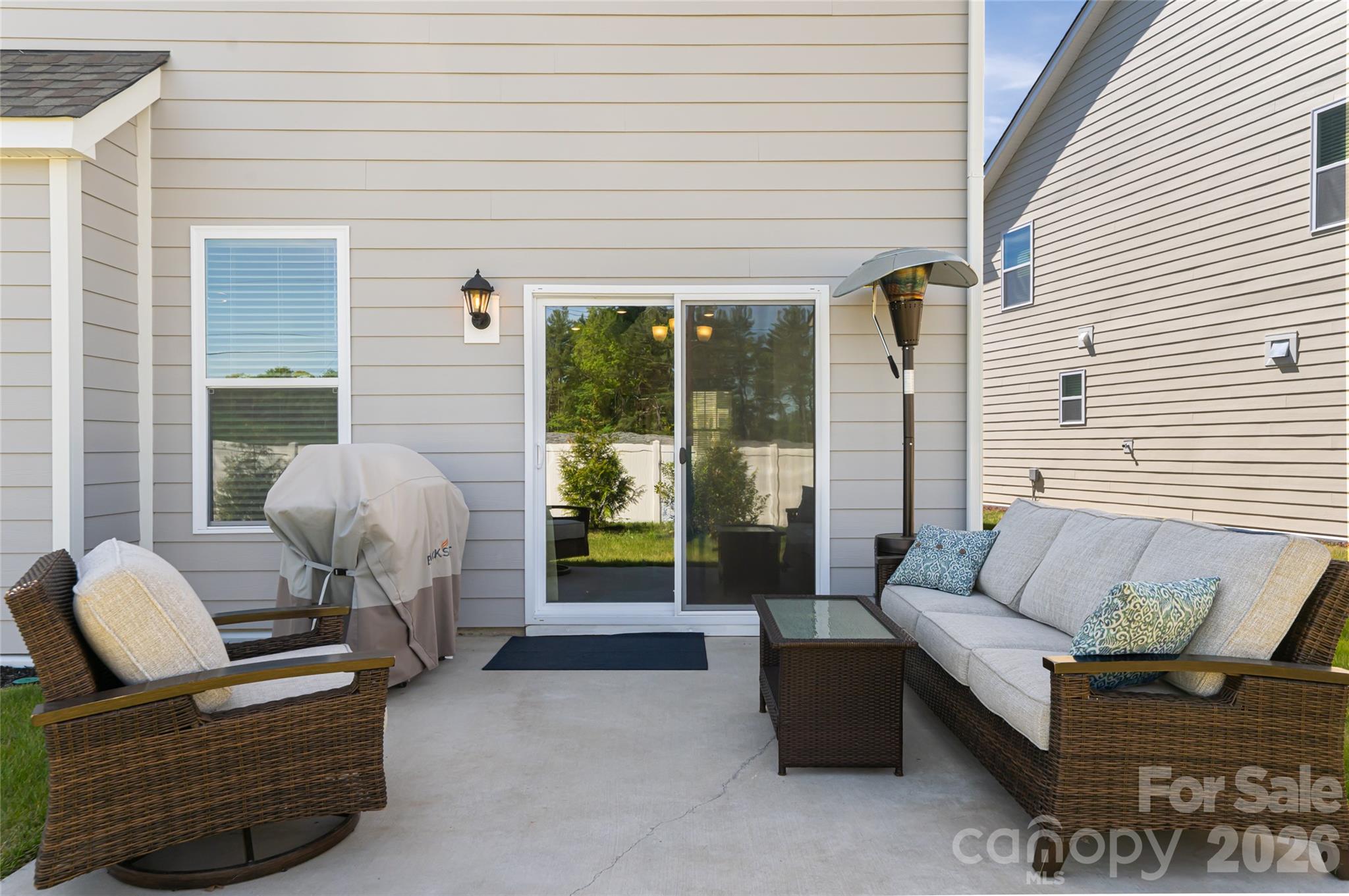 615 Fox Cove Road Hendersonville, NC 28792 - Photo 40 of 47 a view of a patio with couches chairs and potted plants