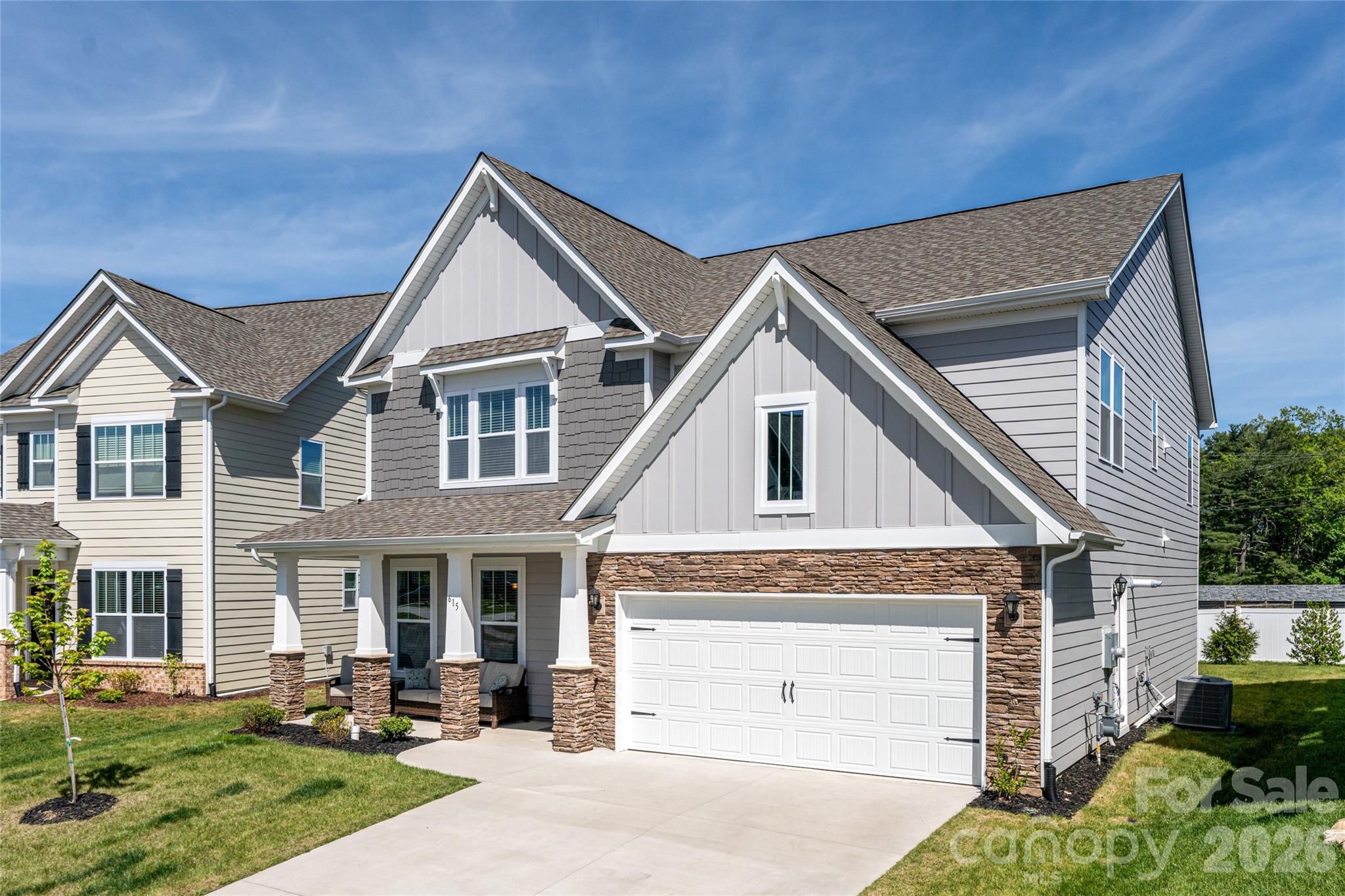 615 Fox Cove Road Hendersonville, NC 28792 - Photo 8 of 47 a front view of a house with a yard and garage