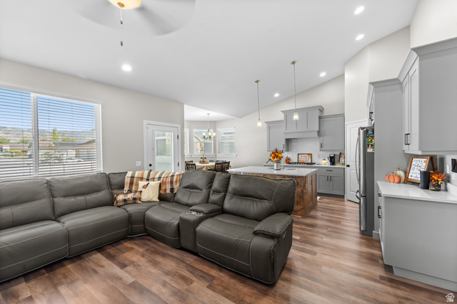 3678 Spiral Springs Road, Unit 204 Tooele, UT 84074 - Photo 12 of 59 Spacious living area with wood-finish flooring and vaulted ceilings
