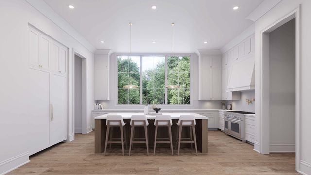 a kitchen with stainless steel appliances a sink and a large window