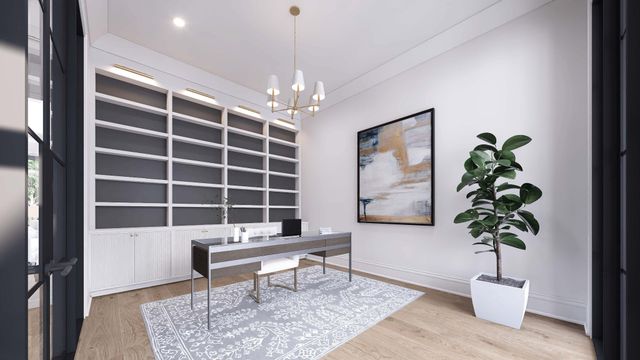 a view of a livingroom with a potted plant and wooden floor