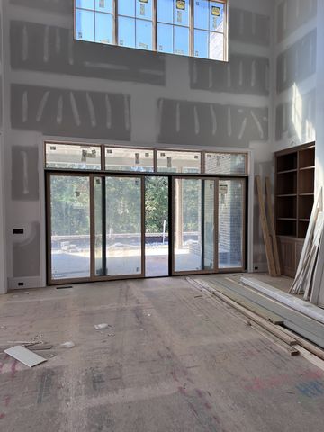 a view of an empty room with a balcony