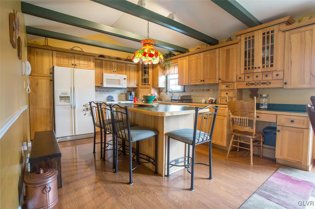 139 West Aluta Mill Road Nazareth, PA 18064 - Photo 5 of 28 a dining area with stainless steel appliances kitchen island granite countertop a table and chairs