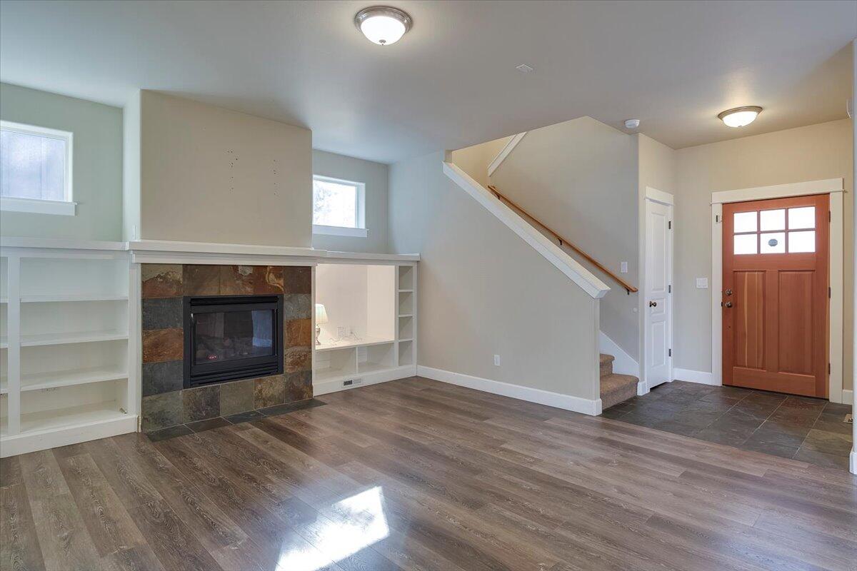 20370 Murphy Road Bend, OR 97702 - Photo 33 of 33 Gas fireplace, and built-in bookshelves, enjoy the great room floor plan