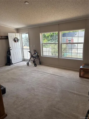 a view of a room with large windows