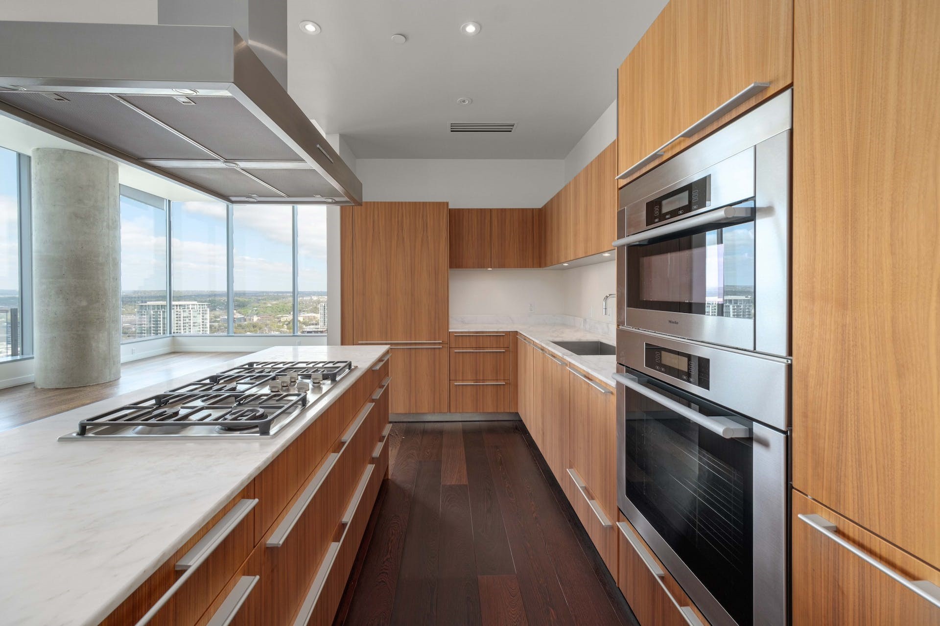 210 Lavaca Street, Unit 2608 Austin, TX 78701 - Photo 1 of 40 a kitchen with stainless steel appliances granite countertop a stove and a refrigerator