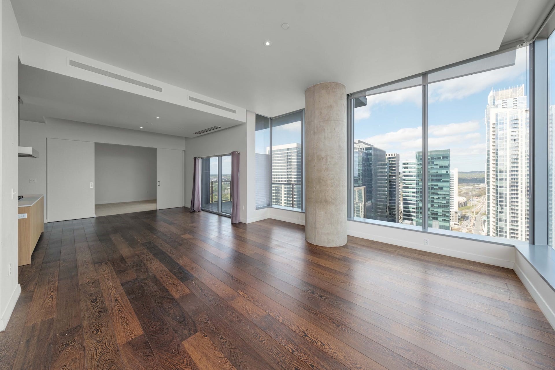 210 Lavaca Street, Unit 2608 Austin, TX 78701 - Photo 11 of 40 a view of an empty room with wooden floor and a window