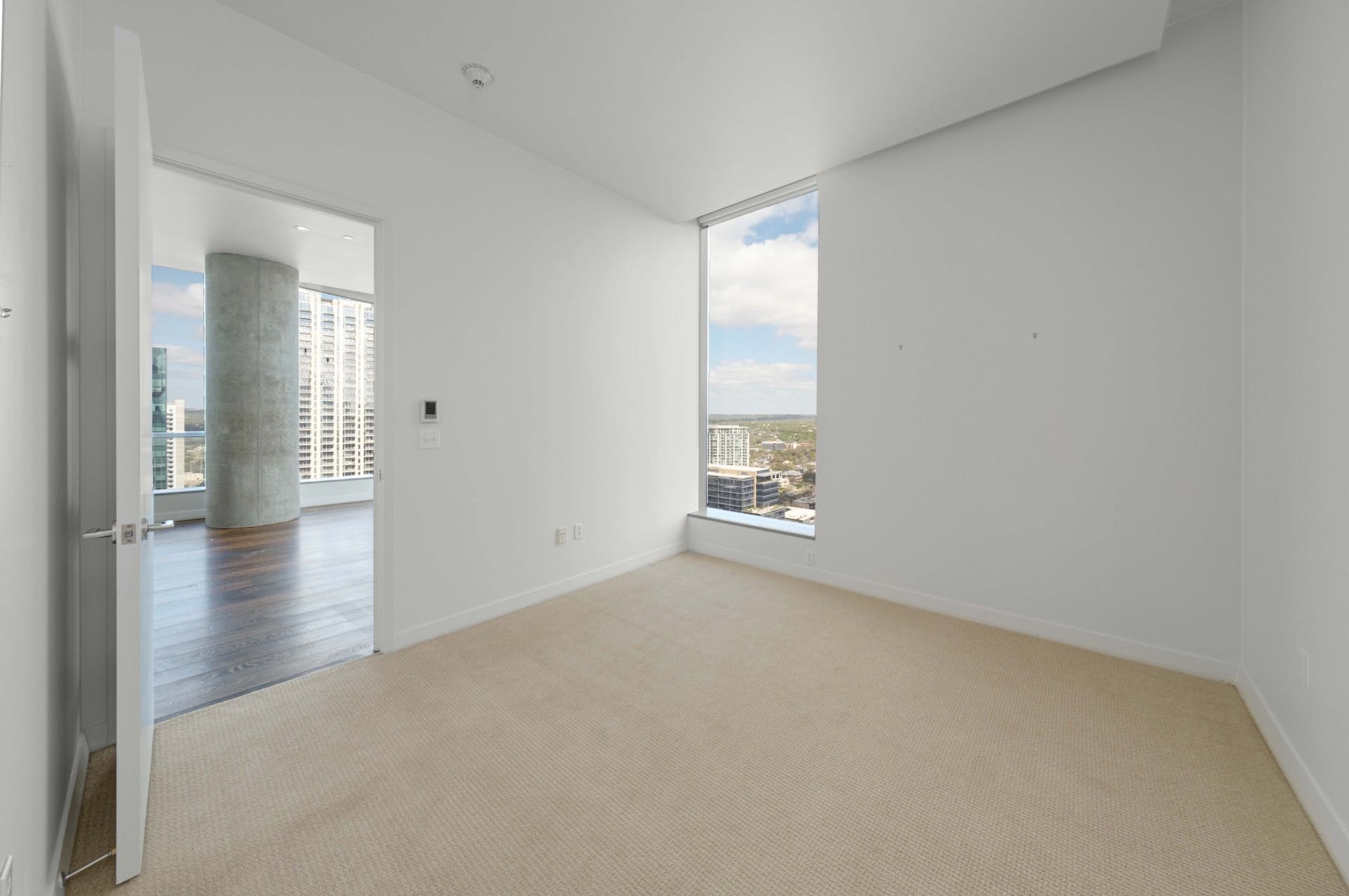 210 Lavaca Street, Unit 2608 Austin, TX 78701 - Photo 14 of 40 an empty room with wooden floor and windows