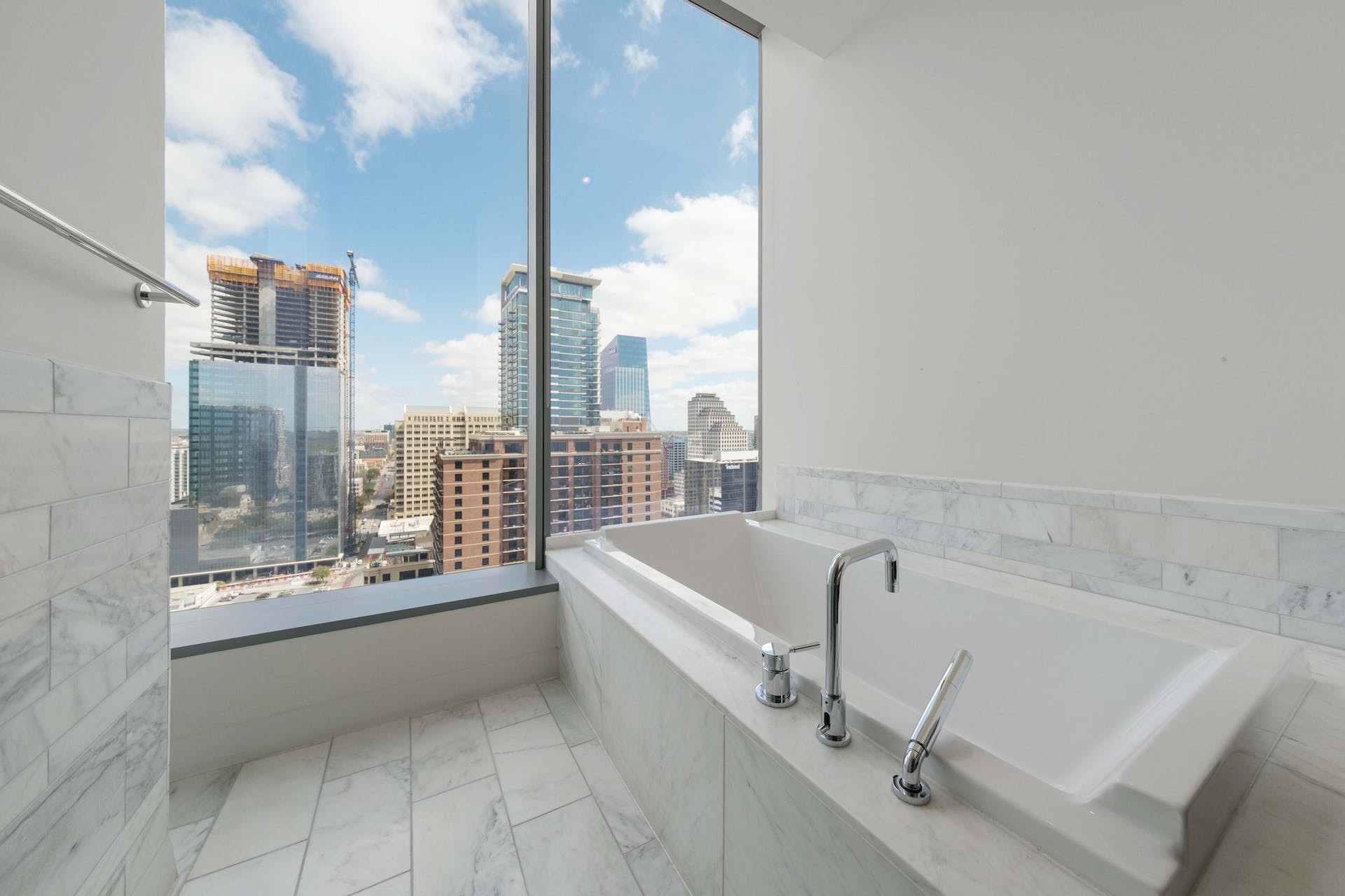 210 Lavaca Street, Unit 2608 Austin, TX 78701 - Photo 19 of 40 a bathroom with a large tub and shower