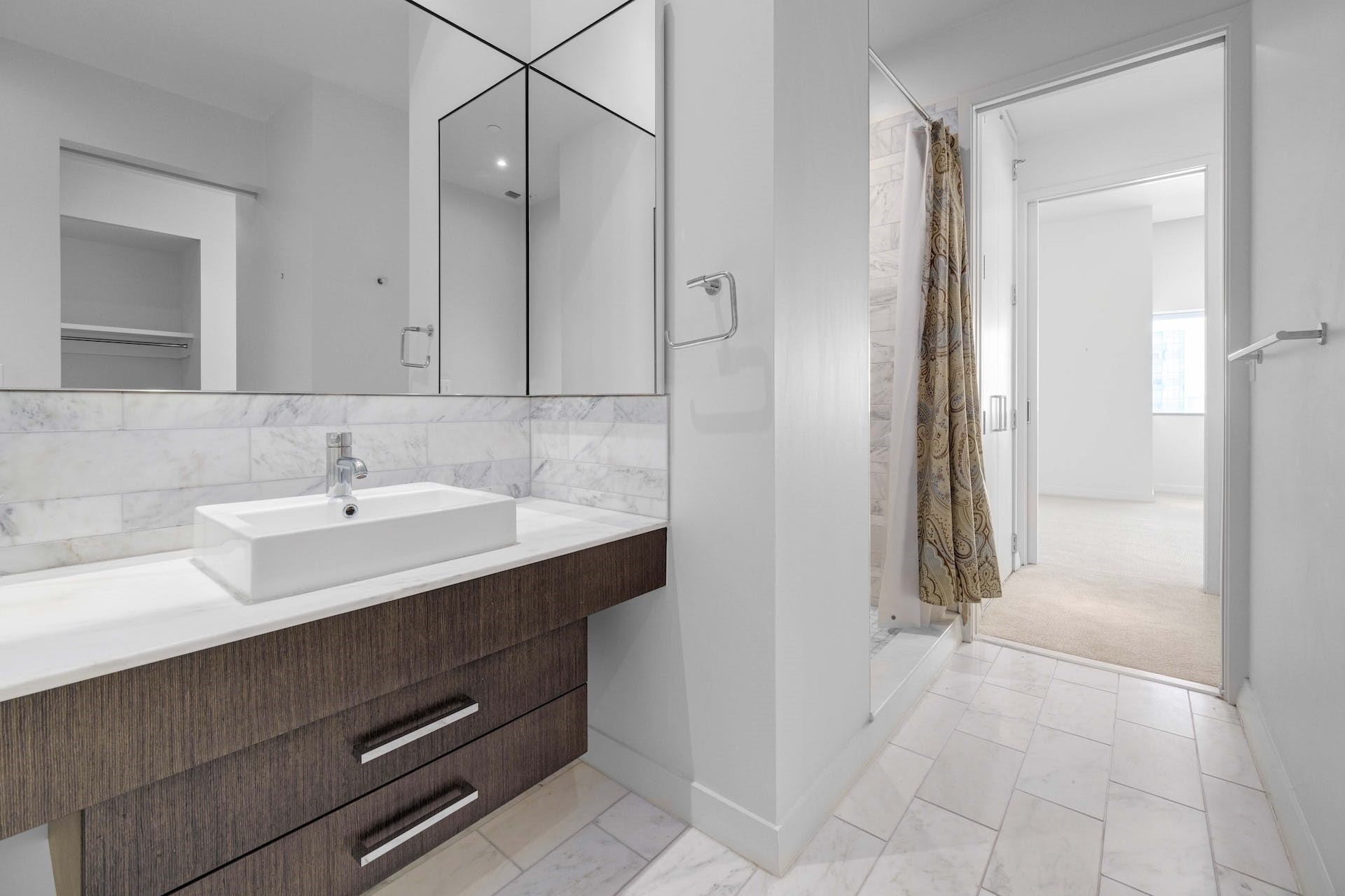 210 Lavaca Street, Unit 2608 Austin, TX 78701 - Photo 23 of 40 a bathroom with a sink and a mirror