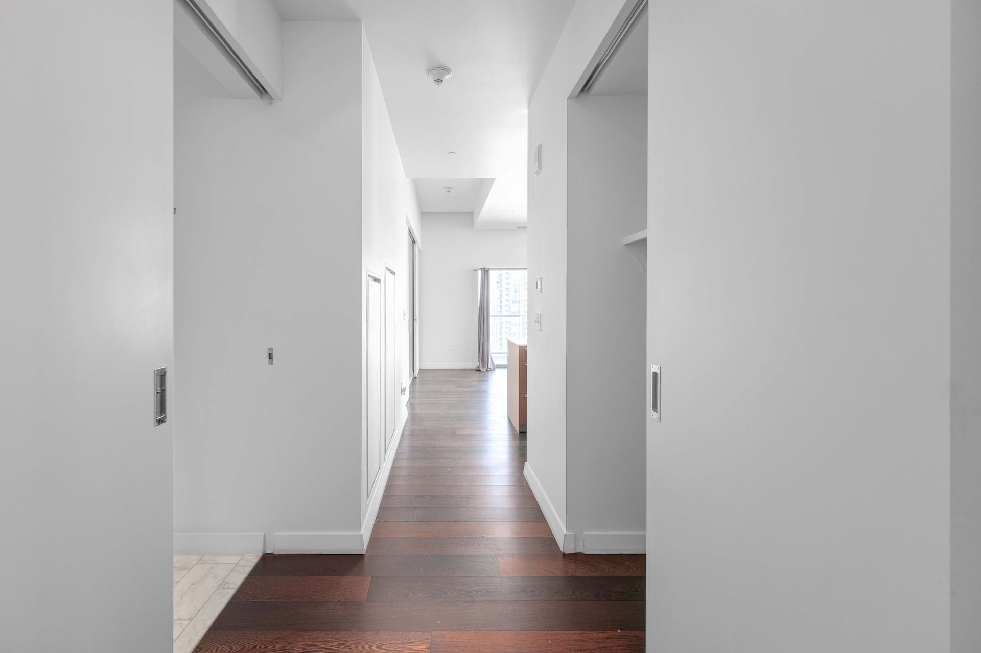 210 Lavaca Street, Unit 2608 Austin, TX 78701 - Photo 24 of 40 a view of a hallway with wooden floor