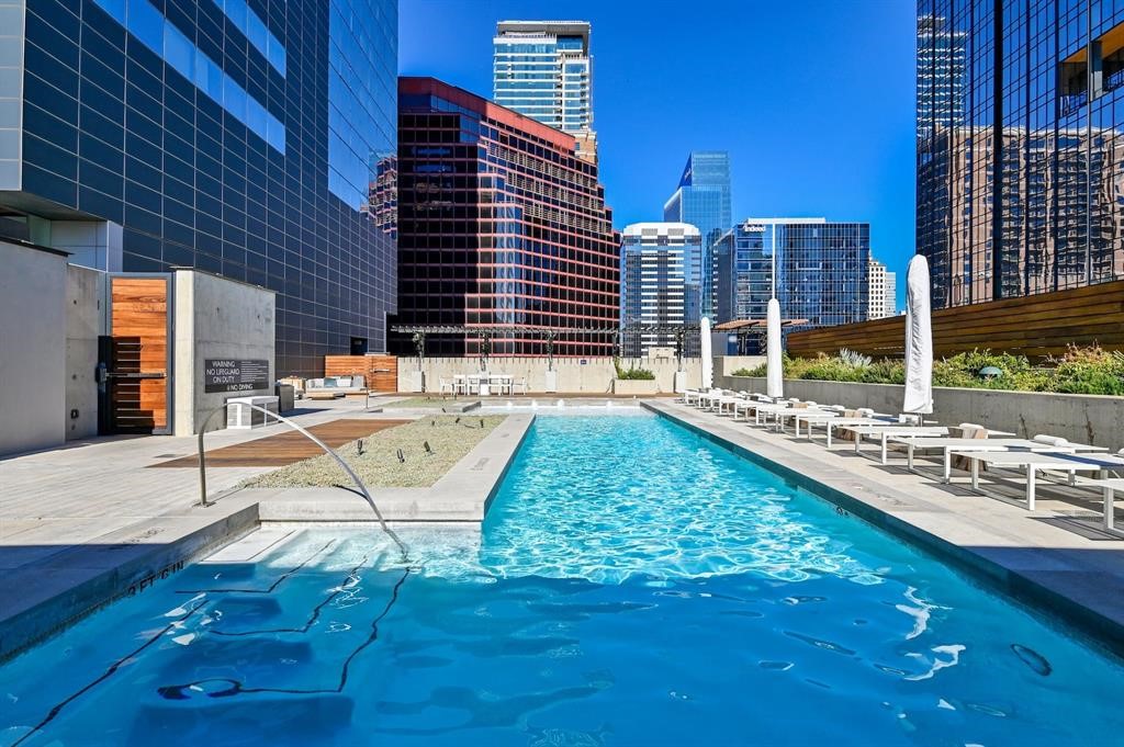 210 Lavaca Street, Unit 2608 Austin, TX 78701 - Photo 4 of 40 a swimming pool with outdoor seating and yard
