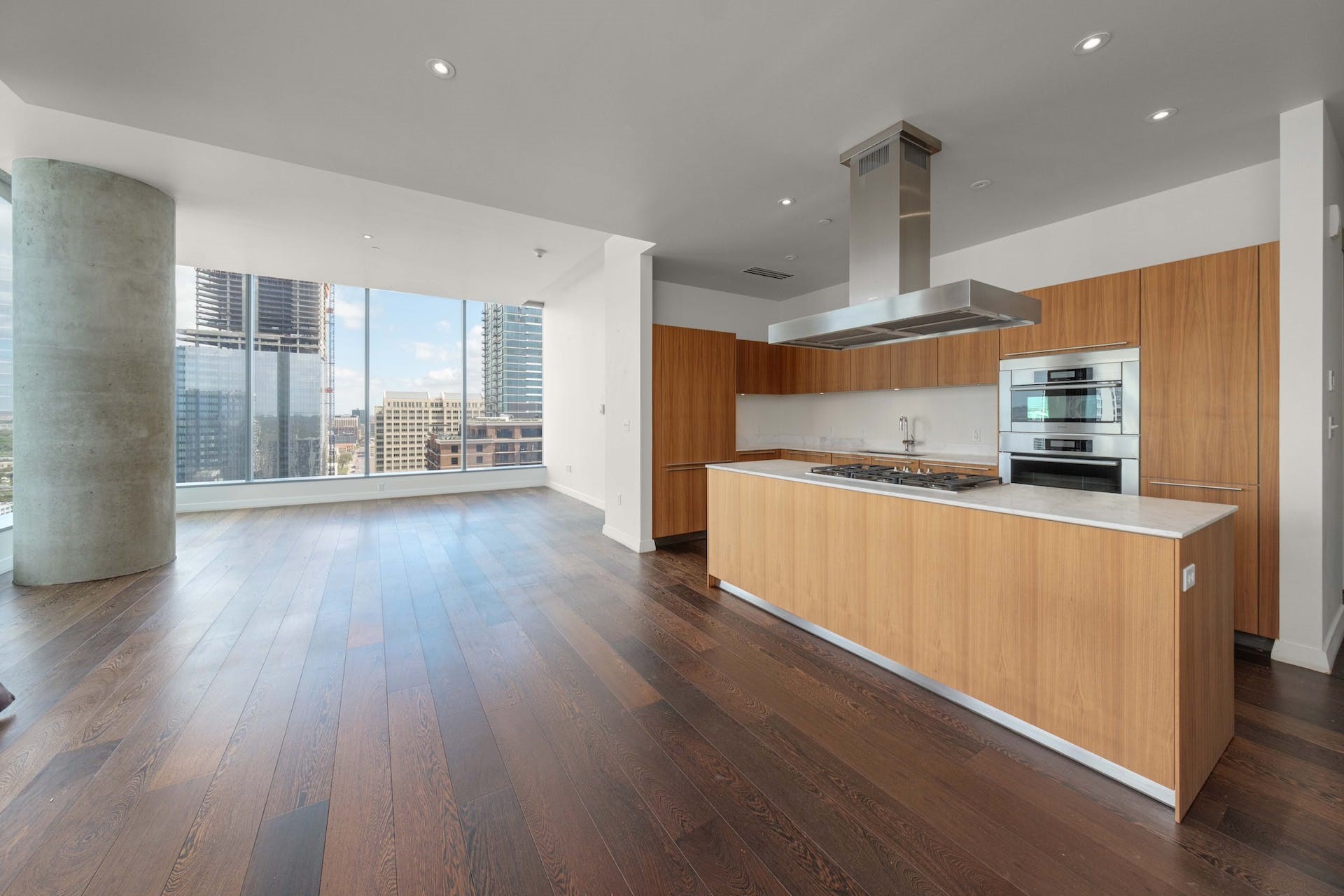 210 Lavaca Street, Unit 2608 Austin, TX 78701 - Photo 6 of 40 a kitchen with stainless steel appliances a refrigerator and wooden floor