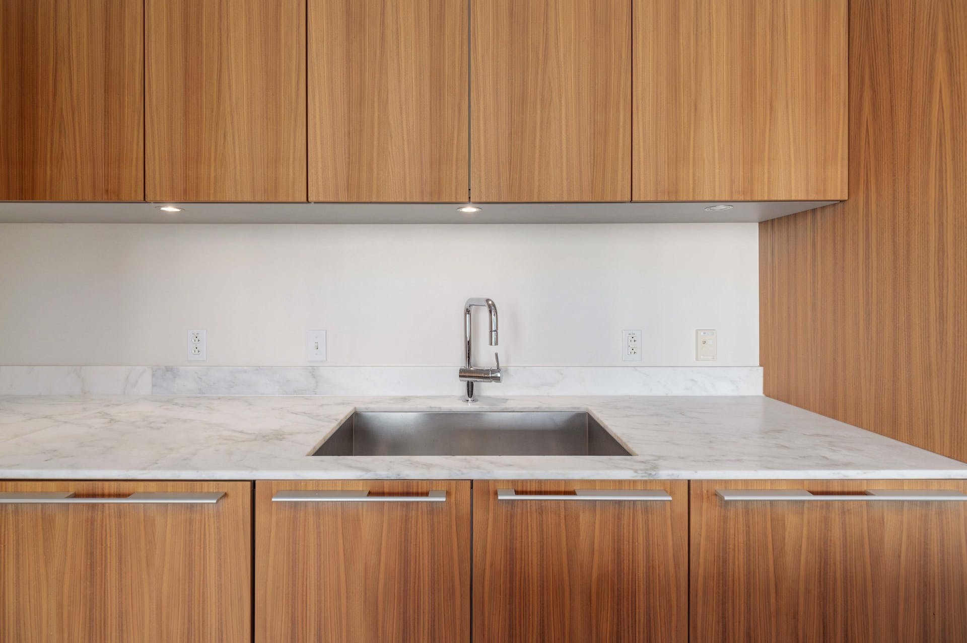210 Lavaca Street, Unit 2608 Austin, TX 78701 - Photo 7 of 40 a kitchen with a sink cabinets and appliances