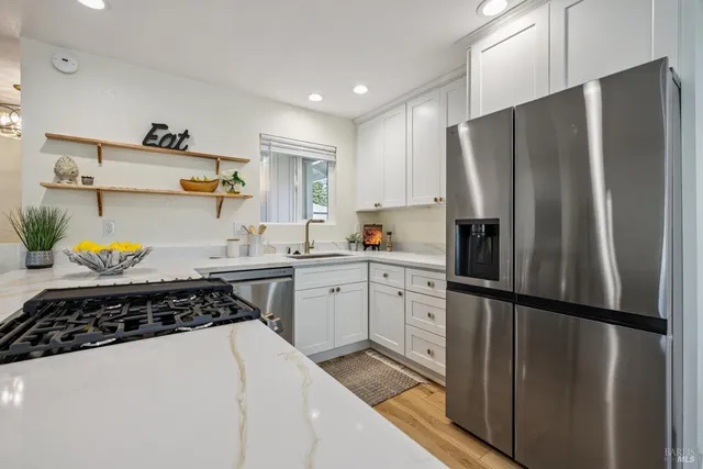 a kitchen with a sink and cabinets