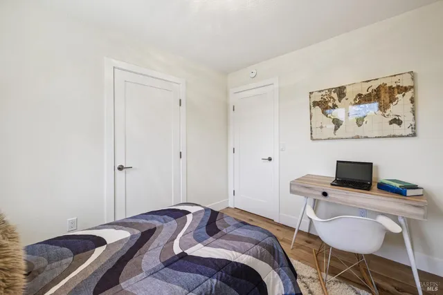 a bedroom with a bed and a closet