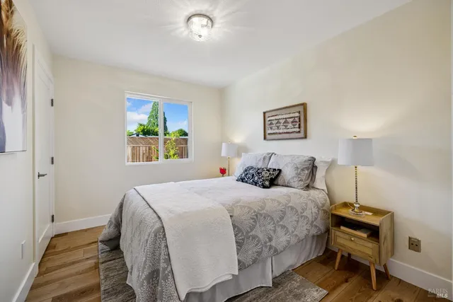 a bedroom with a bed and a lamp