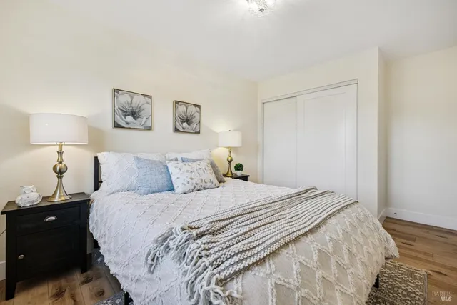 a bedroom with double bed and a window