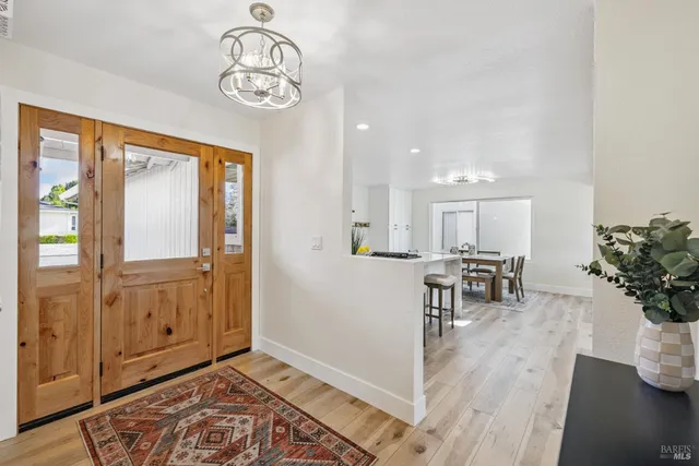 a view of entryway with wooden floor