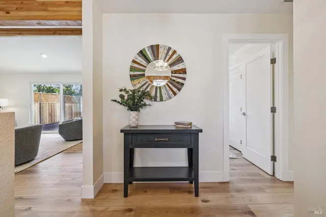 a living room with furniture potted plant and a window