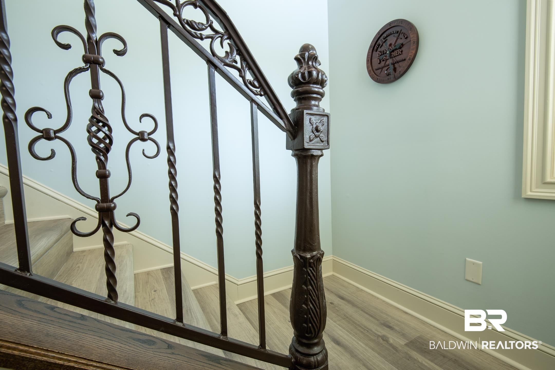 9357 Lakeview Drive Foley, AL 36535 - Photo 57 of 68 Staircase featuring decorative wrought iron balusters and a dark wood newel post