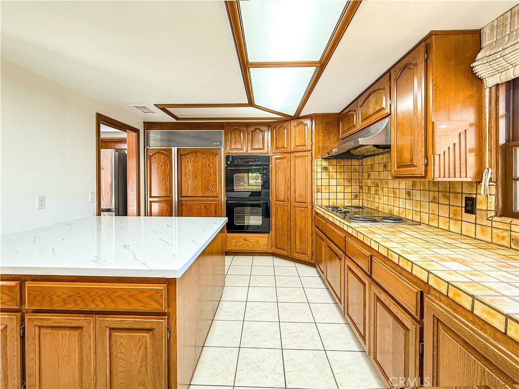 528 West Winnie Way Arcadia, CA 91007 - Photo 12 of 20 a view of a bathroom with stainless steel appliances granite countertop a sink and cabinets