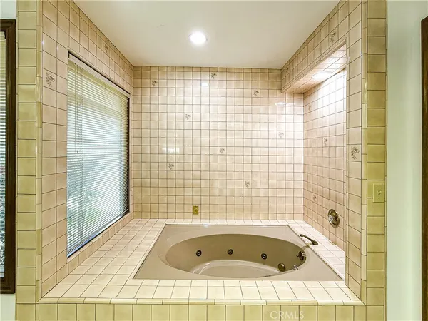a bathroom with a bathtub and shower