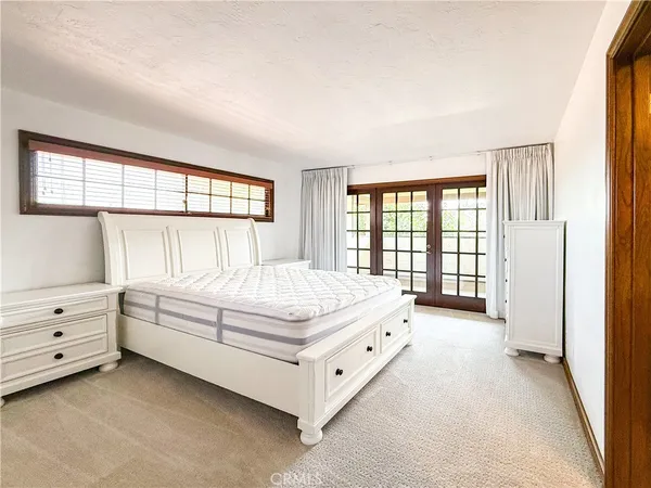 a bed room with a bed and a window