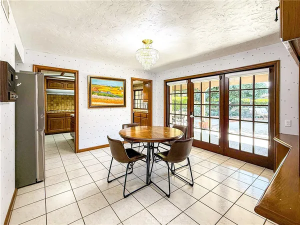 a view of a livingroom with furniture window and outdoor kitchen