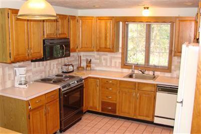 92 Harbor Road Hyannis, MA 02601 - Photo 15 of 22 a kitchen with a sink stove top oven and cabinets