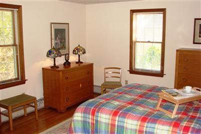 92 Harbor Road Hyannis, MA 02601 - Photo 9 of 22 a bedroom with a bed and windows