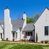 a view of house with yard