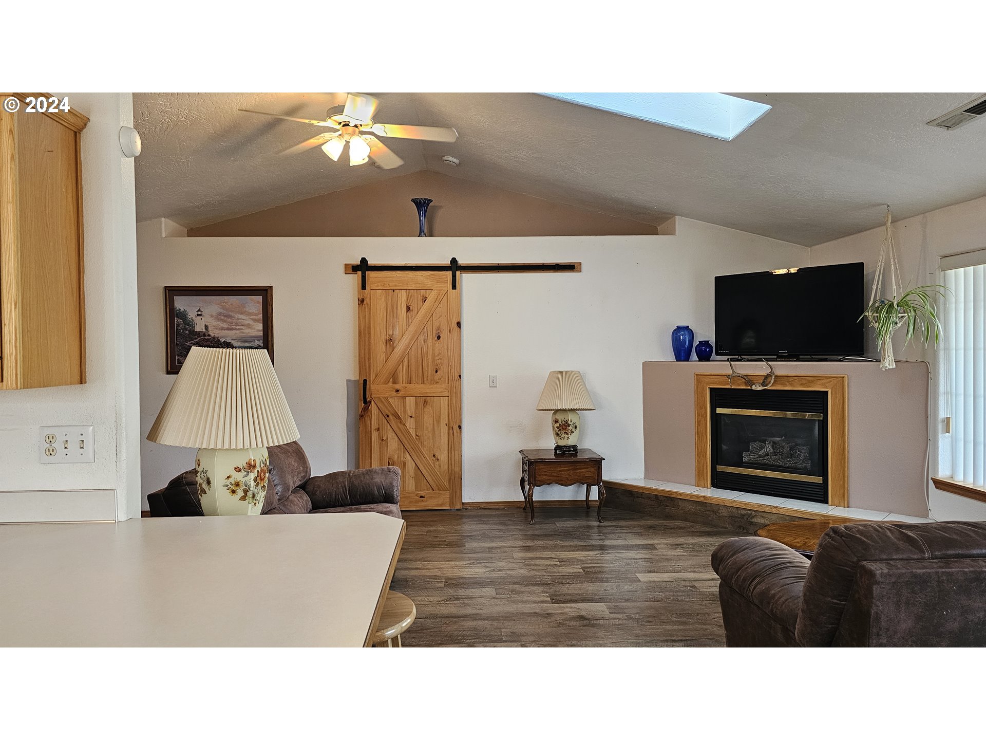 4072 Forsythia Street Springfield, OR 97478 - Photo 11 of 23 a living room with furniture and a fireplace